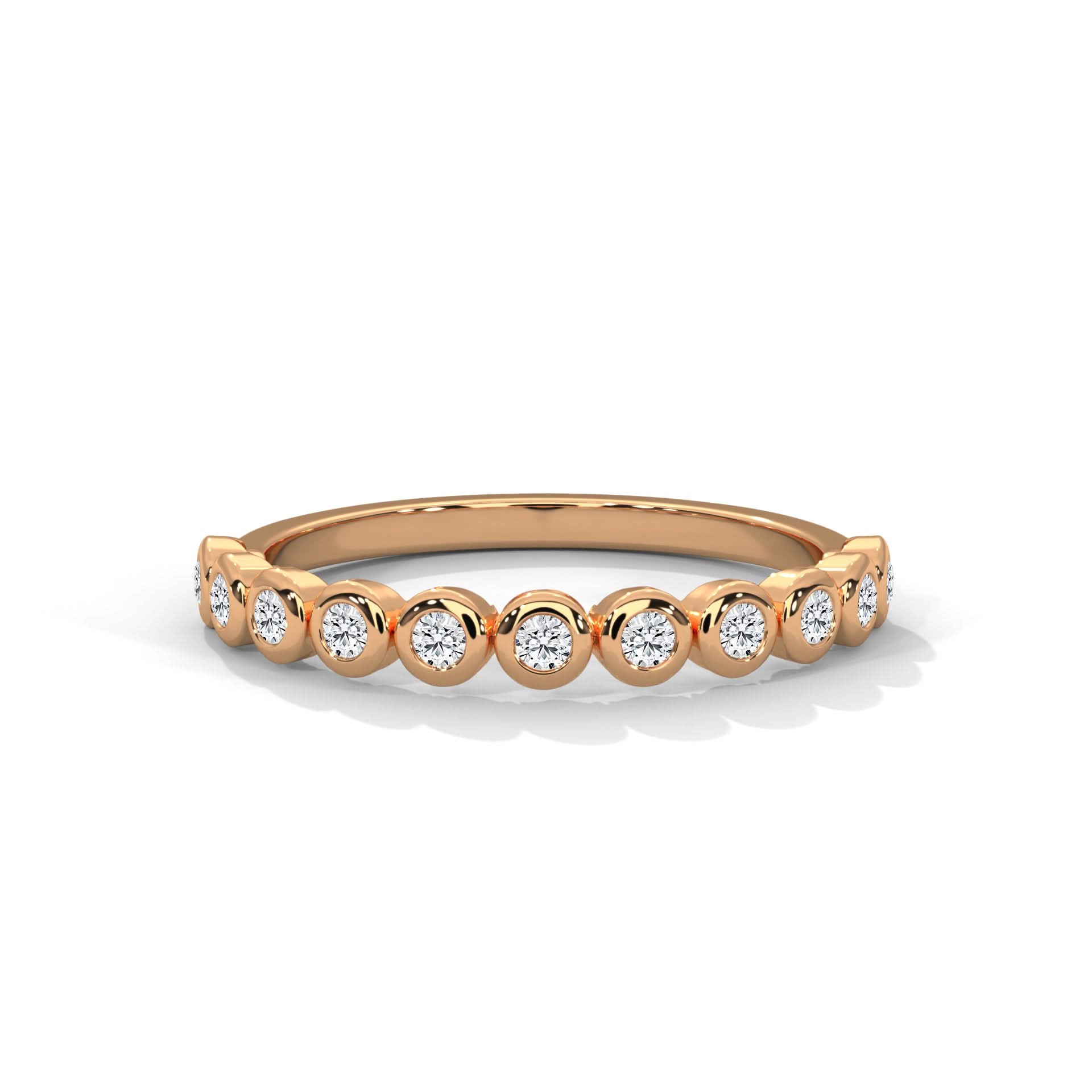 Rose gold ring with Bezel set diamonds on a white background