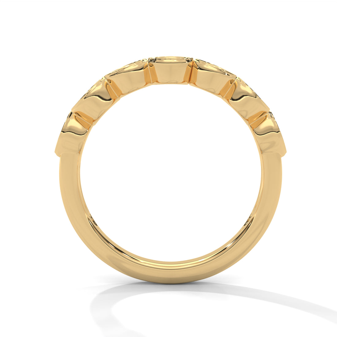 Gold ring with a textured band on a white background