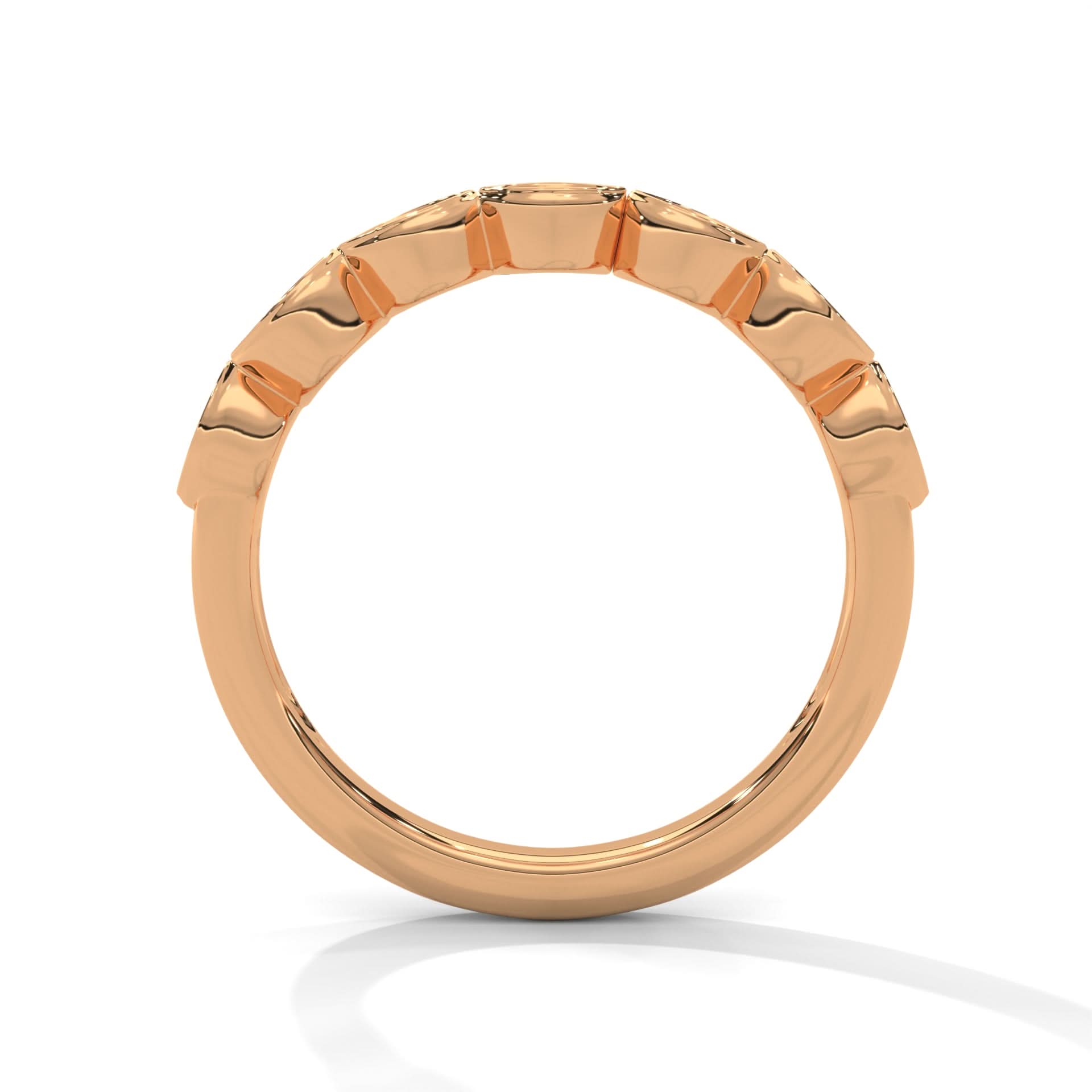 Rose gold ring with a textured band on a white background