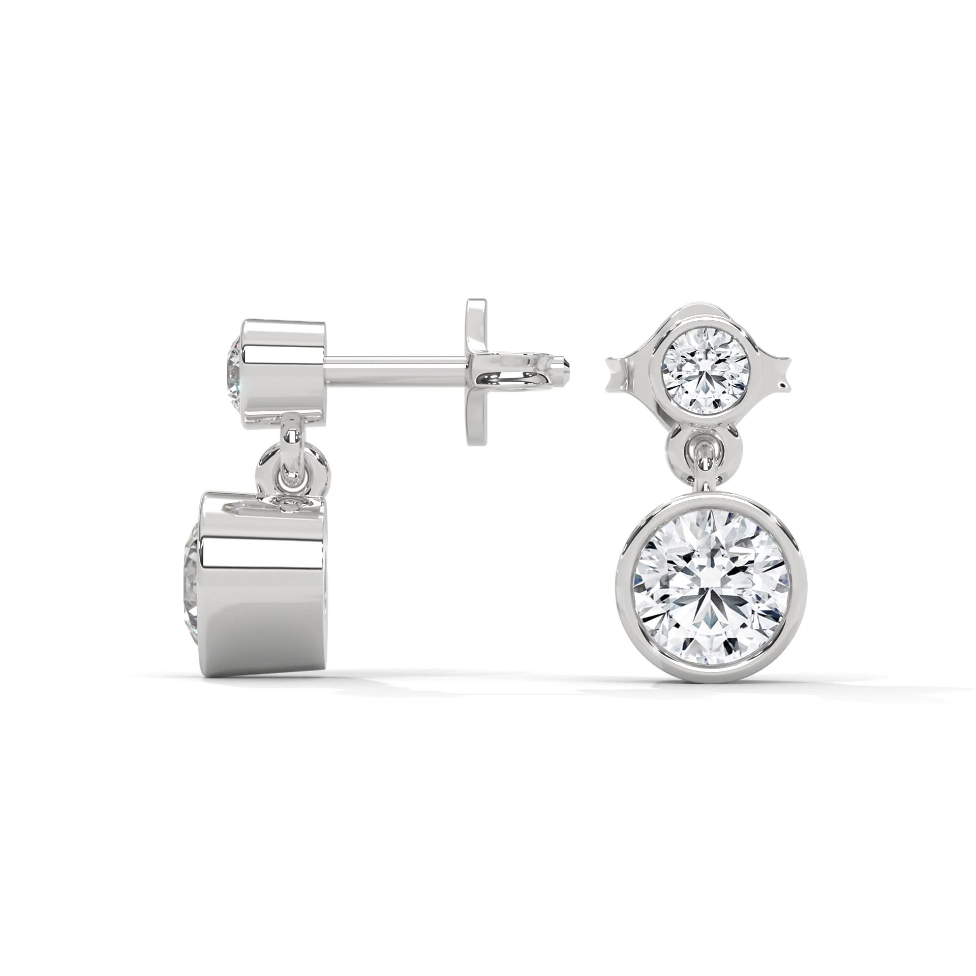 Pair of silver earrings with clear Diamond on a white background