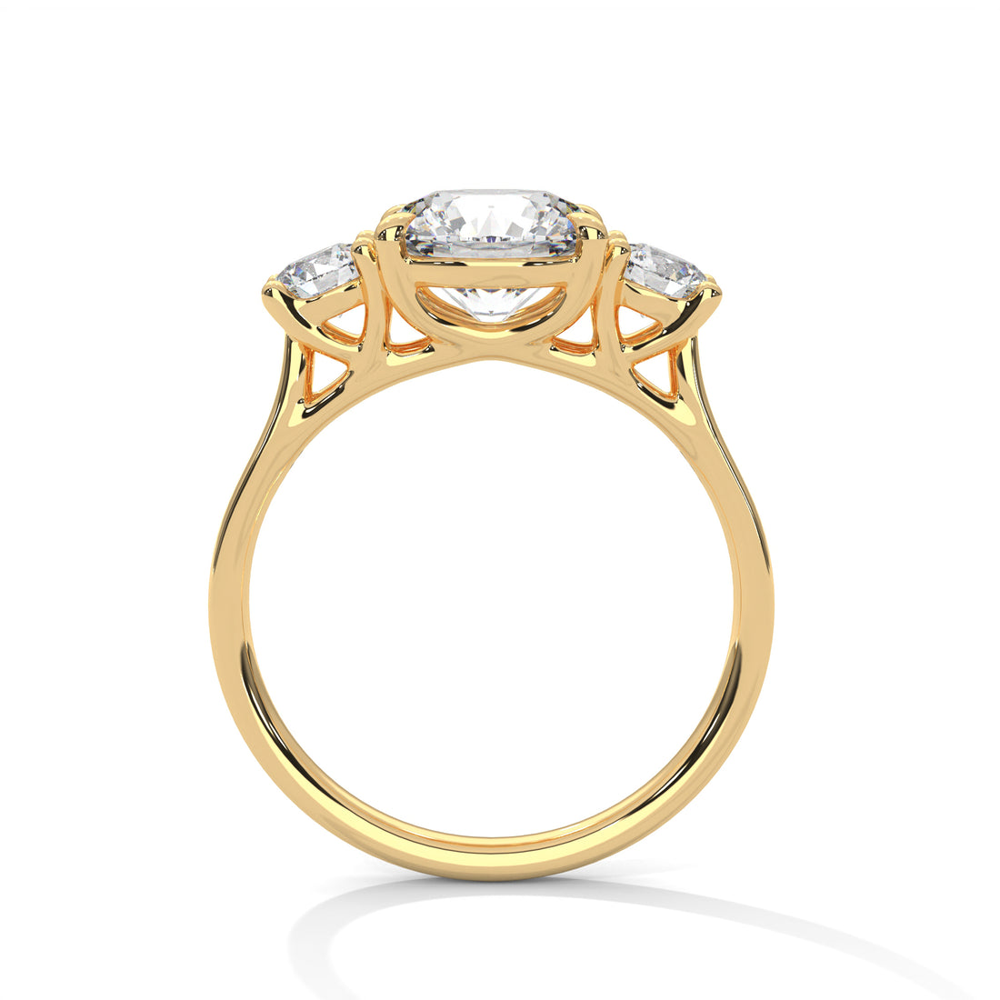 Gold ring with three diamond-like stones on a white background