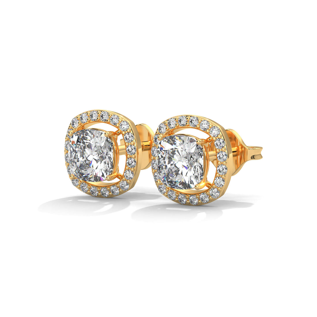 Gold earrings with clear stone on a white background