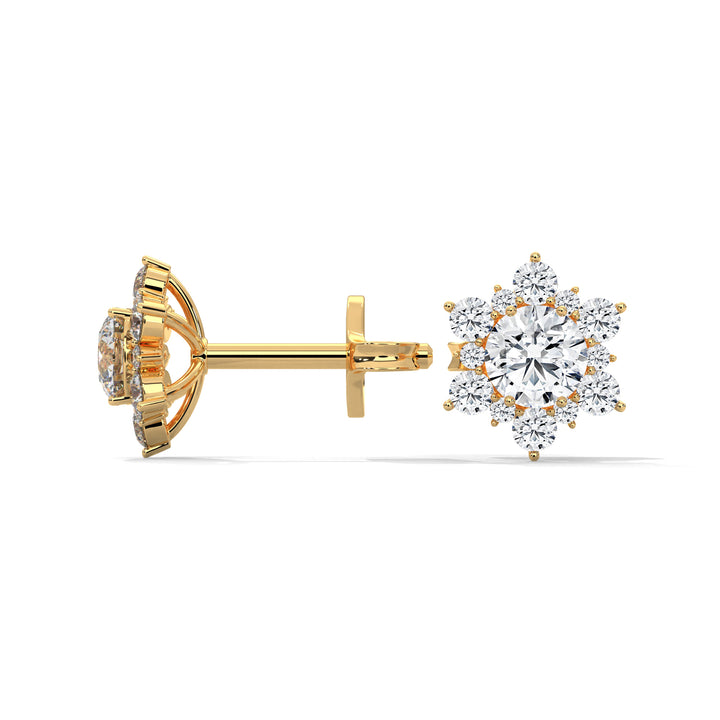 Gold diamond earrings on a white background