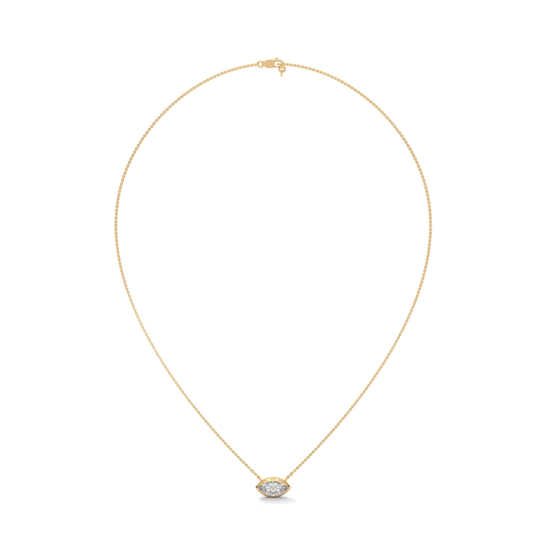 Gold necklace with a small pendant on a white background