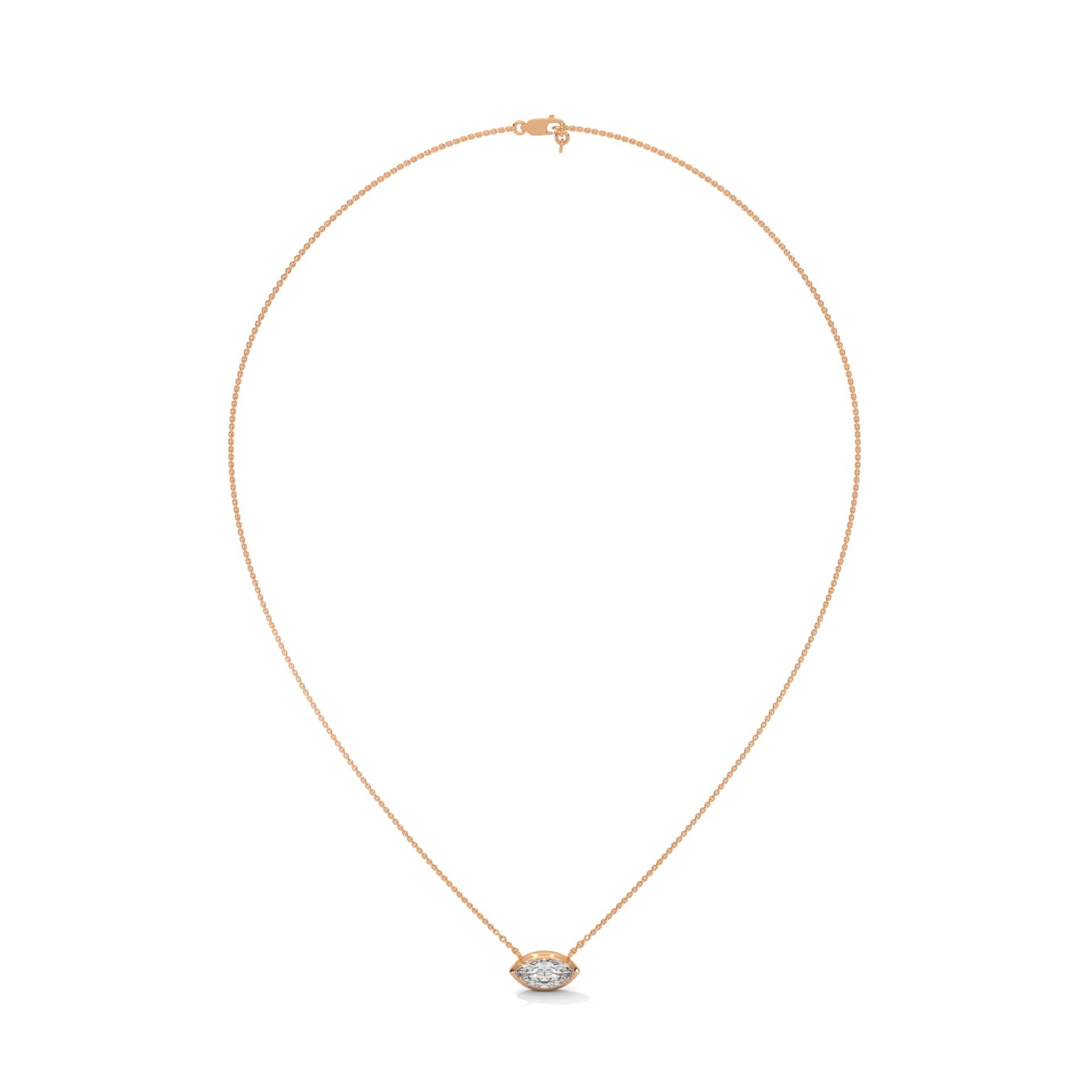 Gold necklace with a small pendant on a white background
