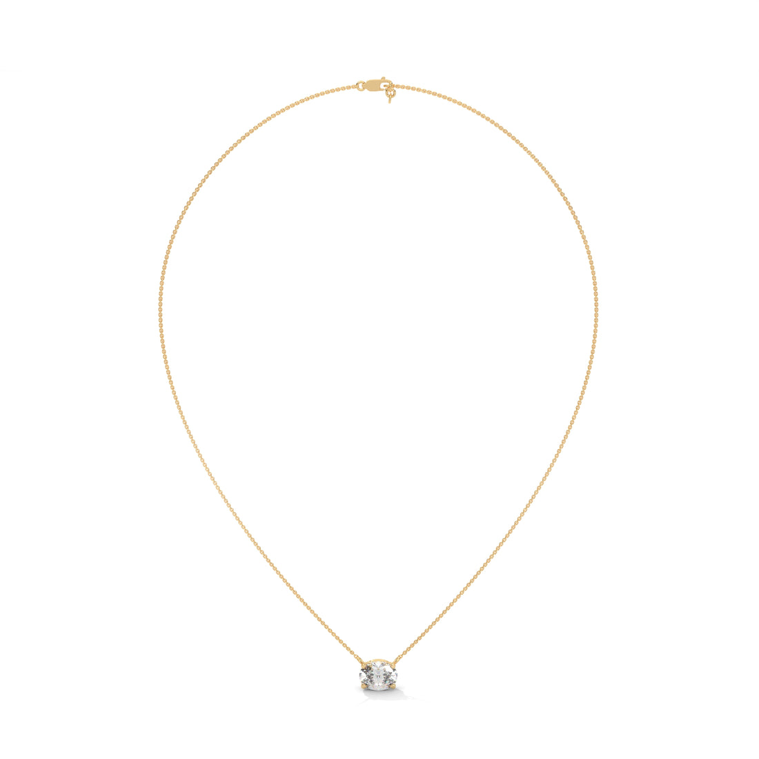 Gold necklace with a small round pendant on a white background