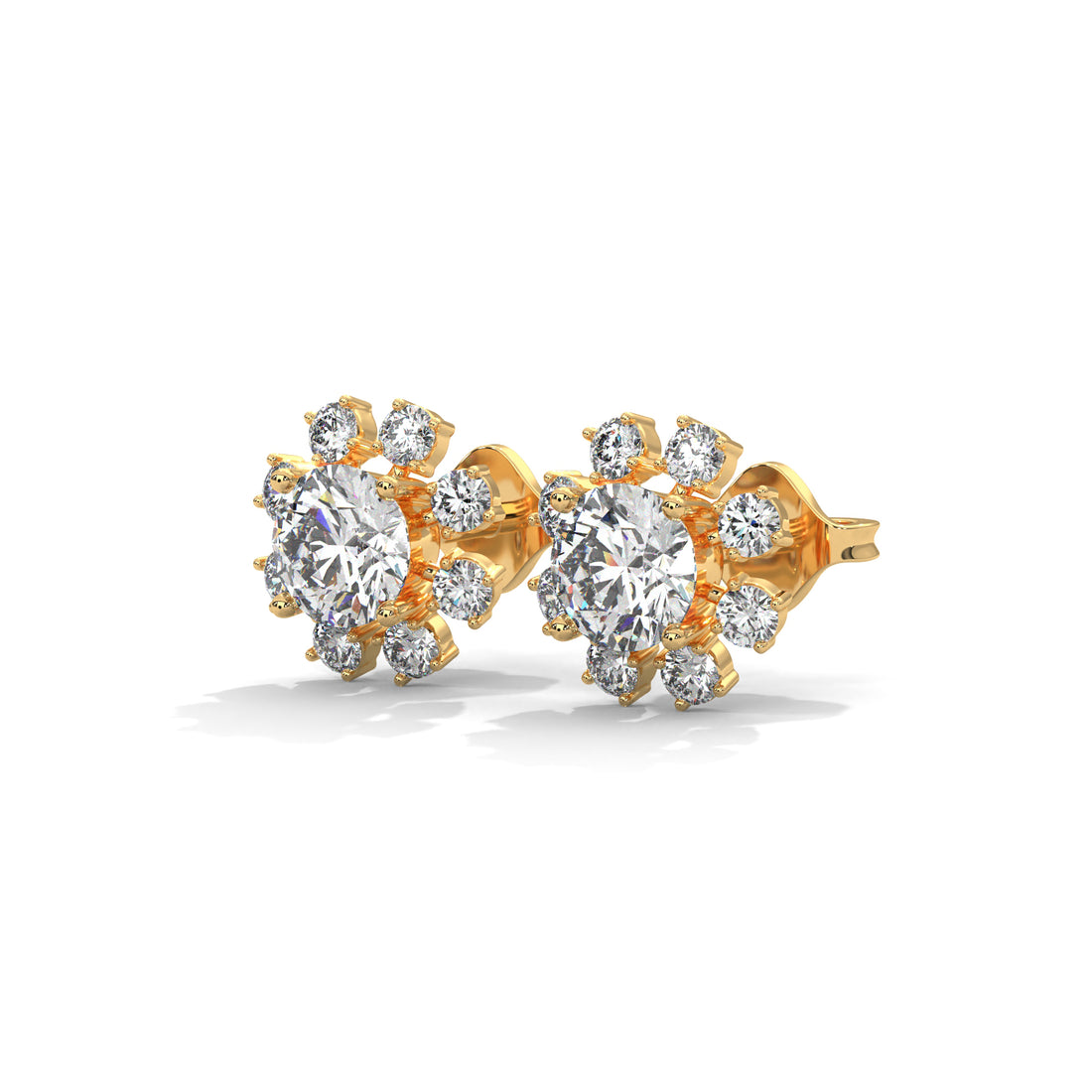Gold earrings with clear gemstones on a white background