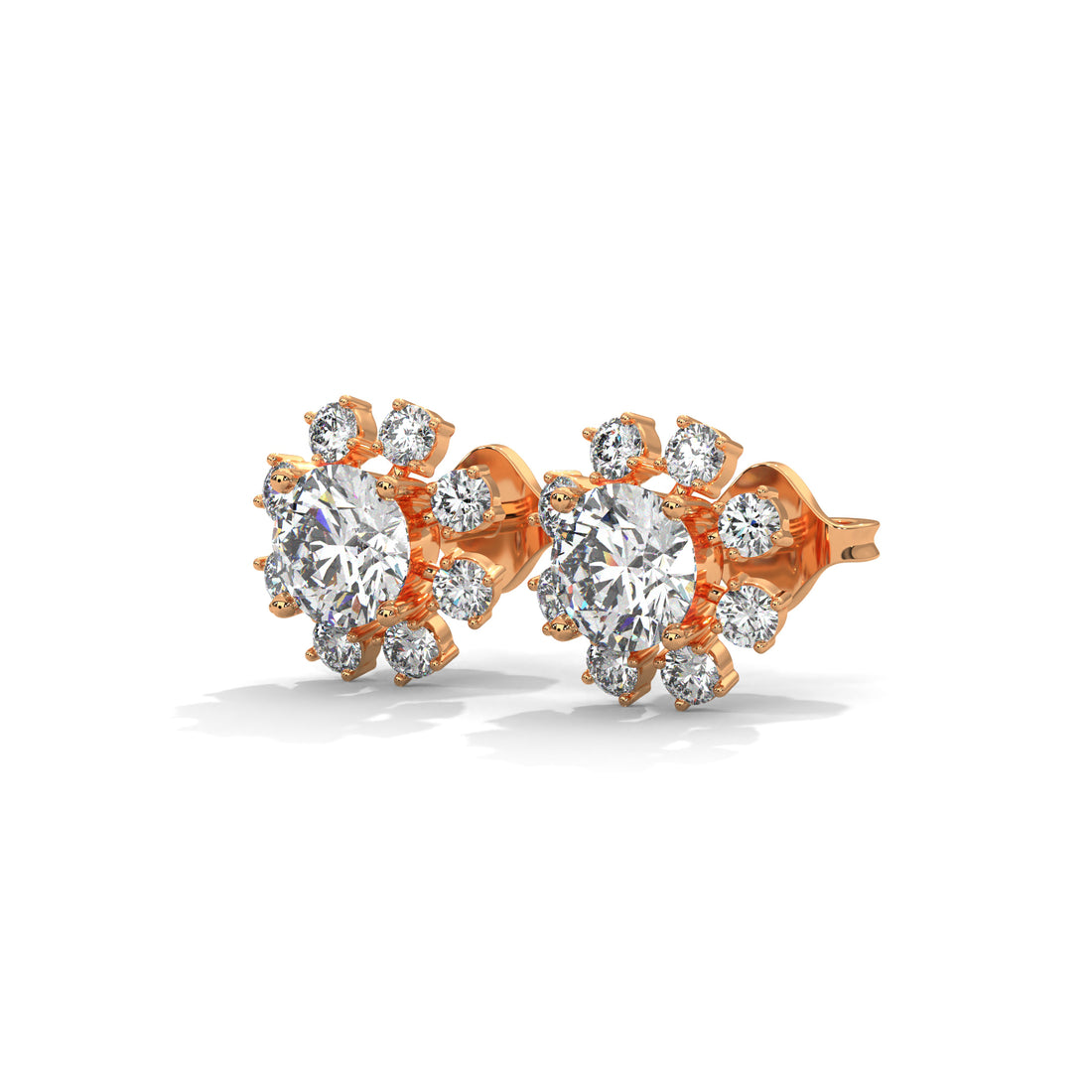 Rose gold earrings with clear gemstones on a white background