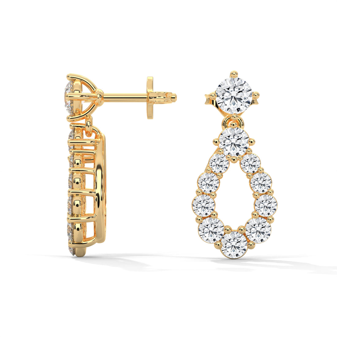 Gold hoop earrings with diamond accents on a white background
