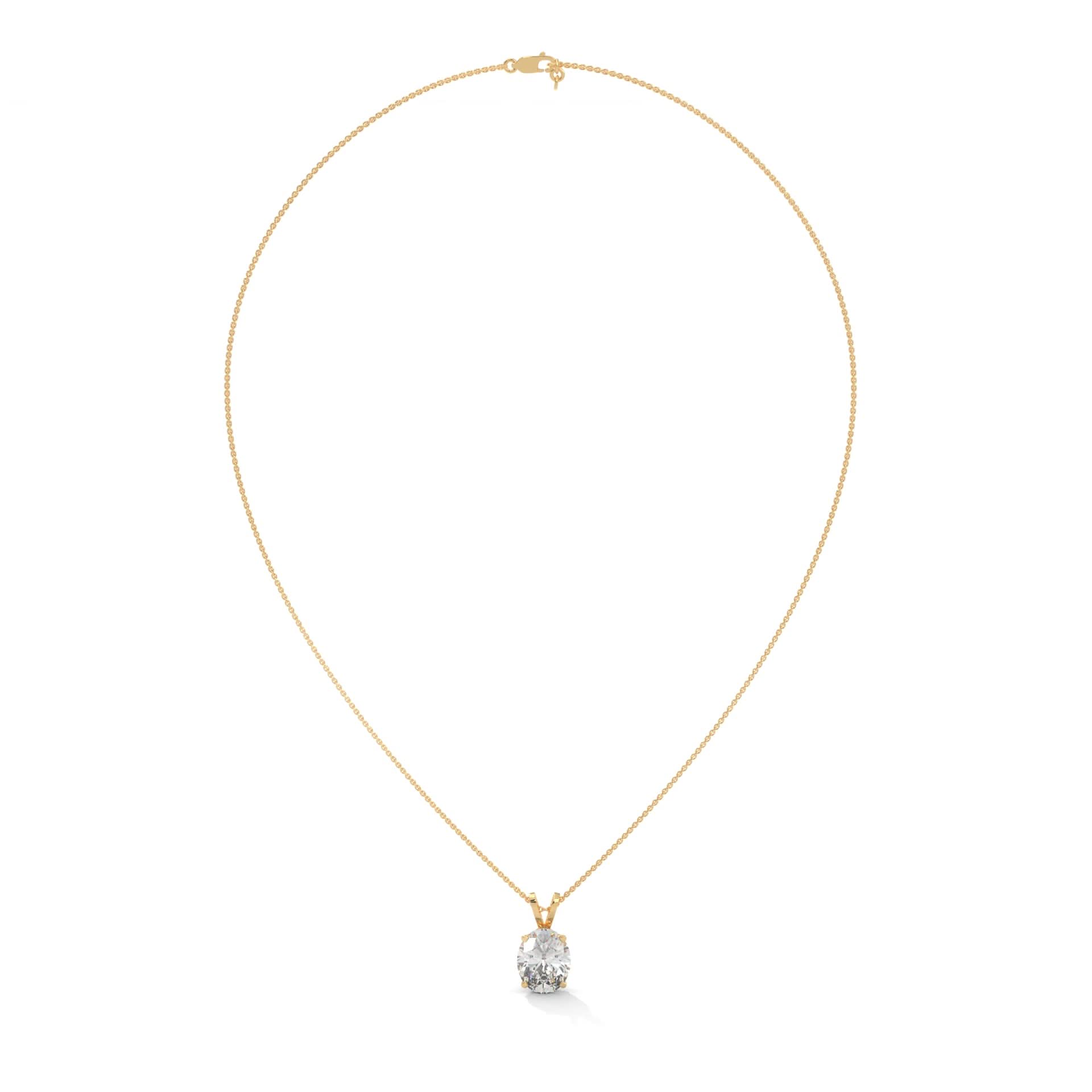 Gold necklace with a diamond pendant on a white background