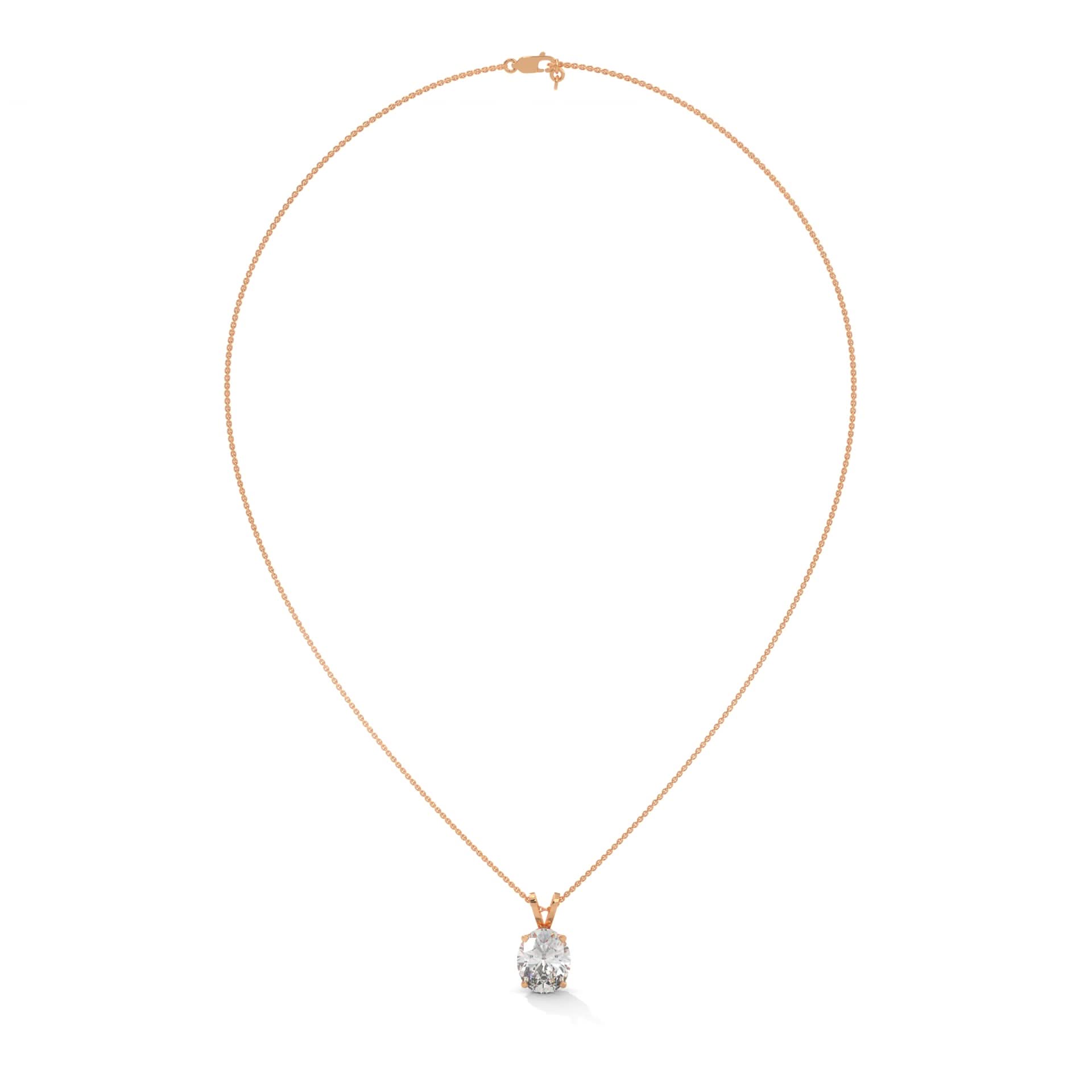 Gold necklace with a diamond pendant on a white background
