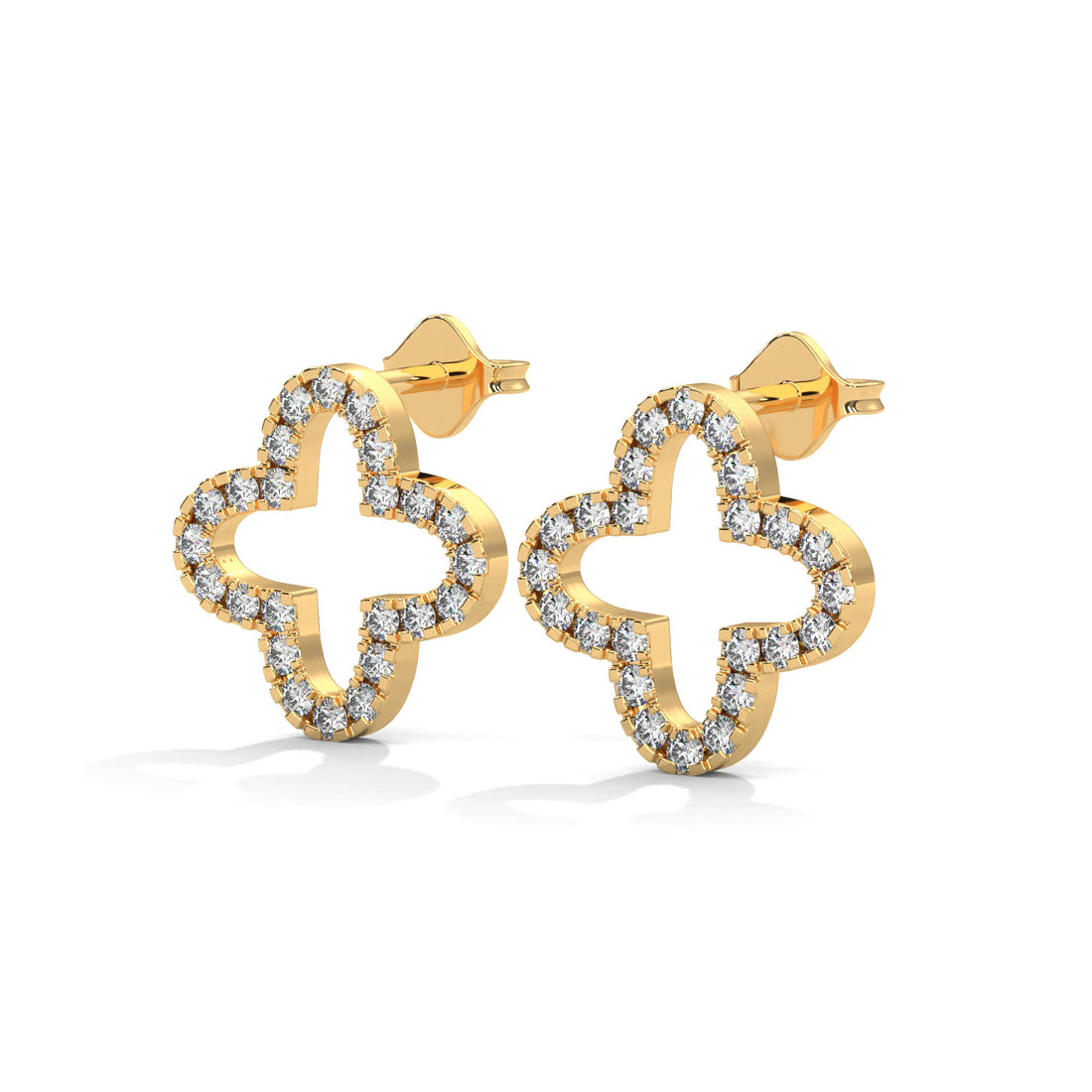 Gold earrings with diamond-studded clover design on a white background