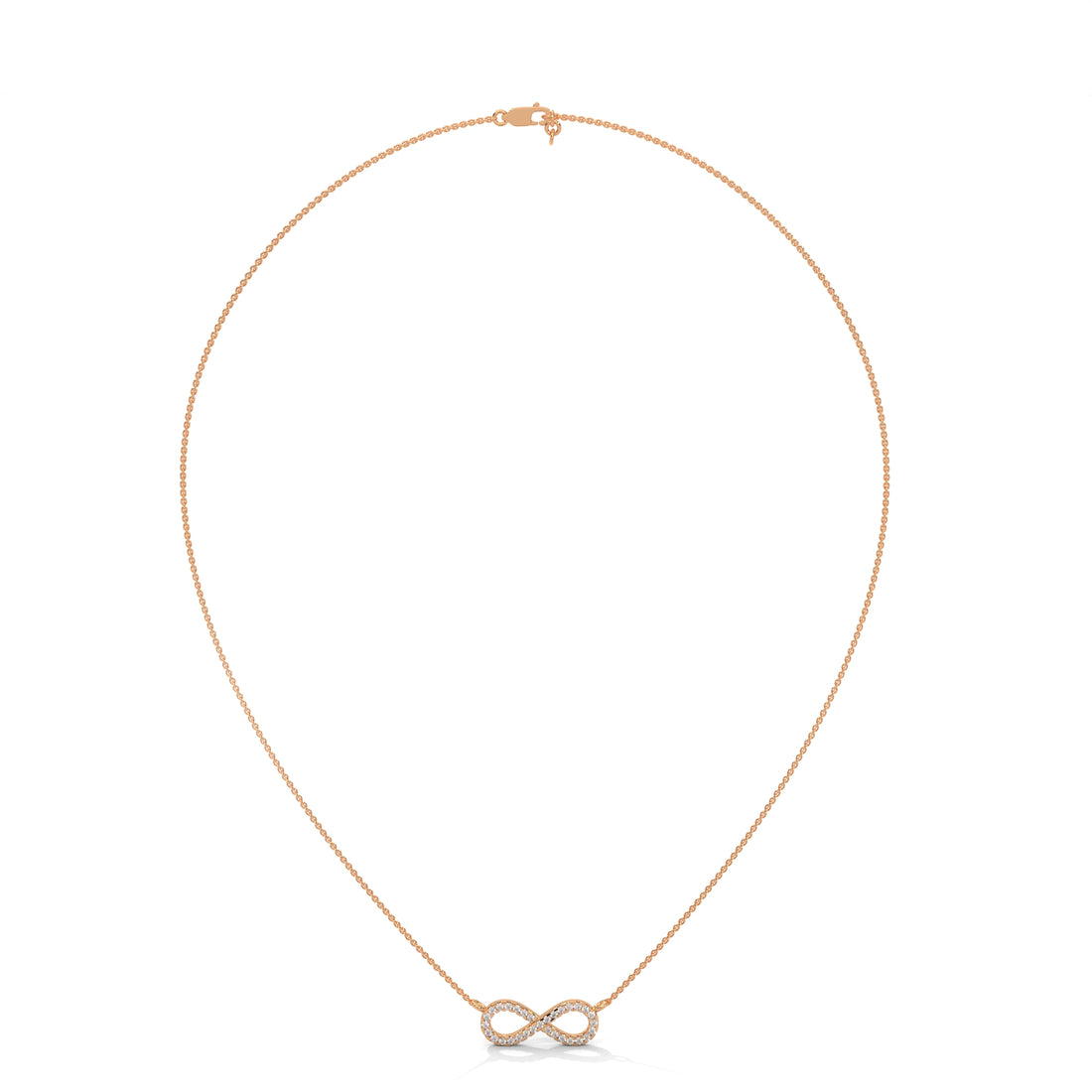 Gold infinity necklace on a white background