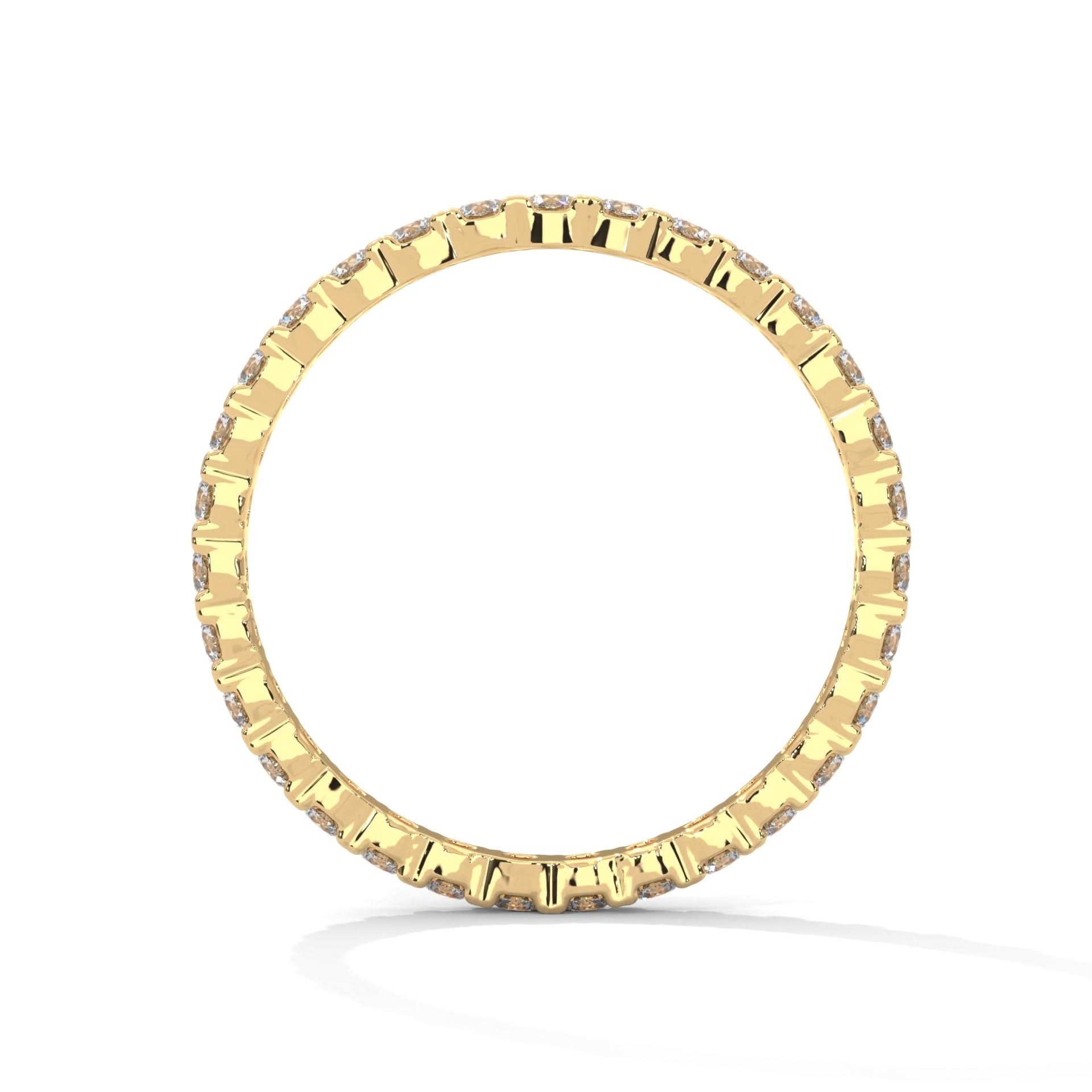 Gold ring with small diamonds on a white background