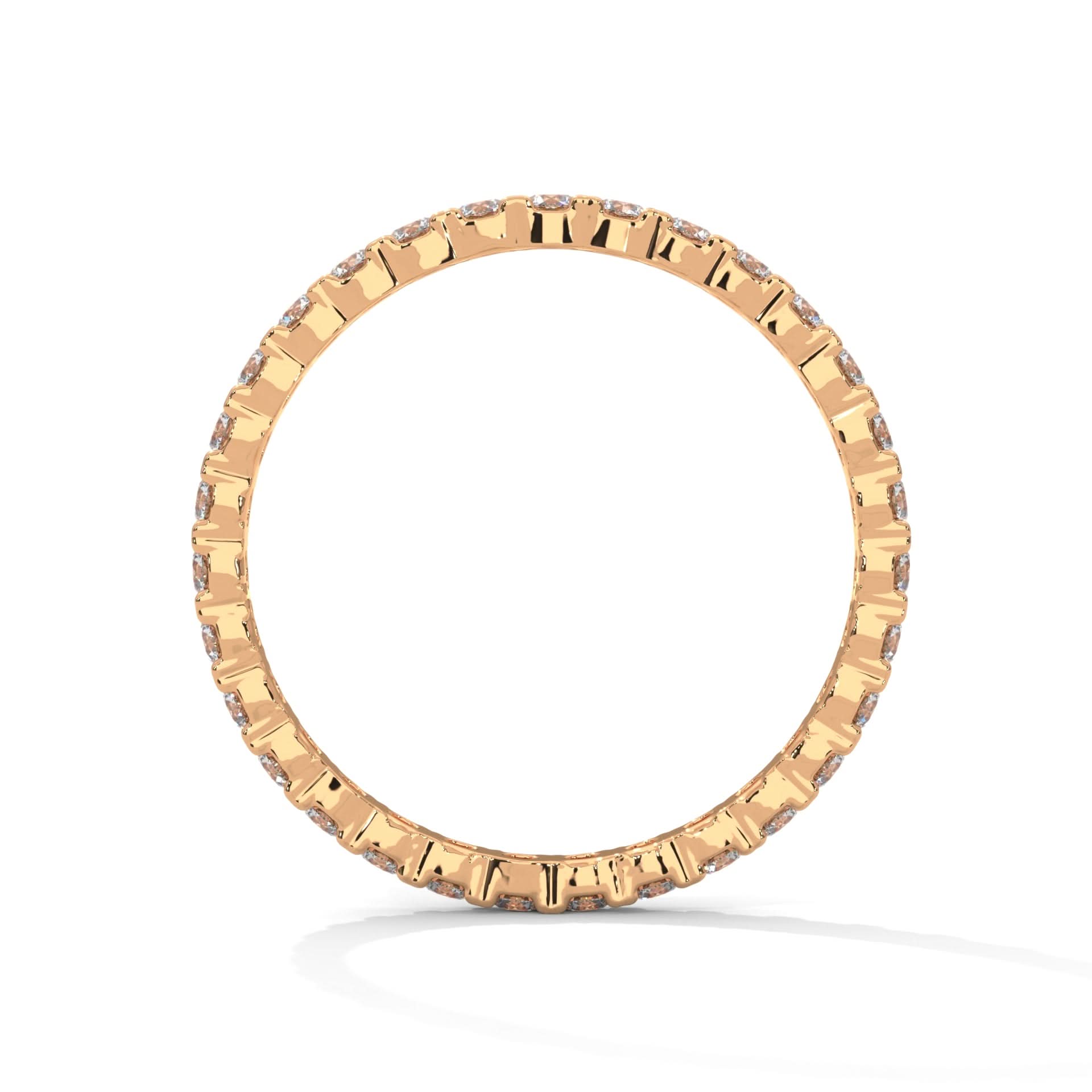 Gold ring with small diamonds on a white background
