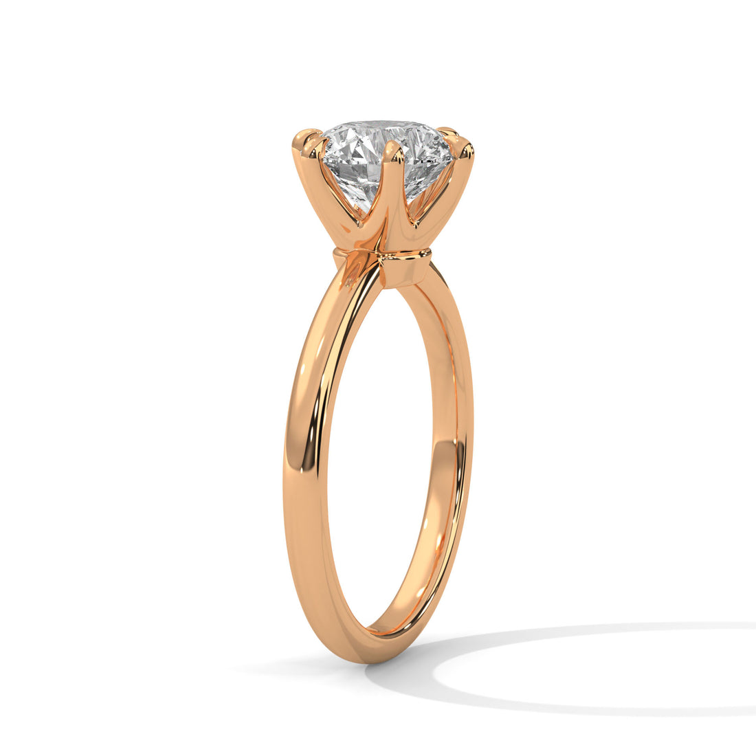 Rose gold ring with a diamond on a white background