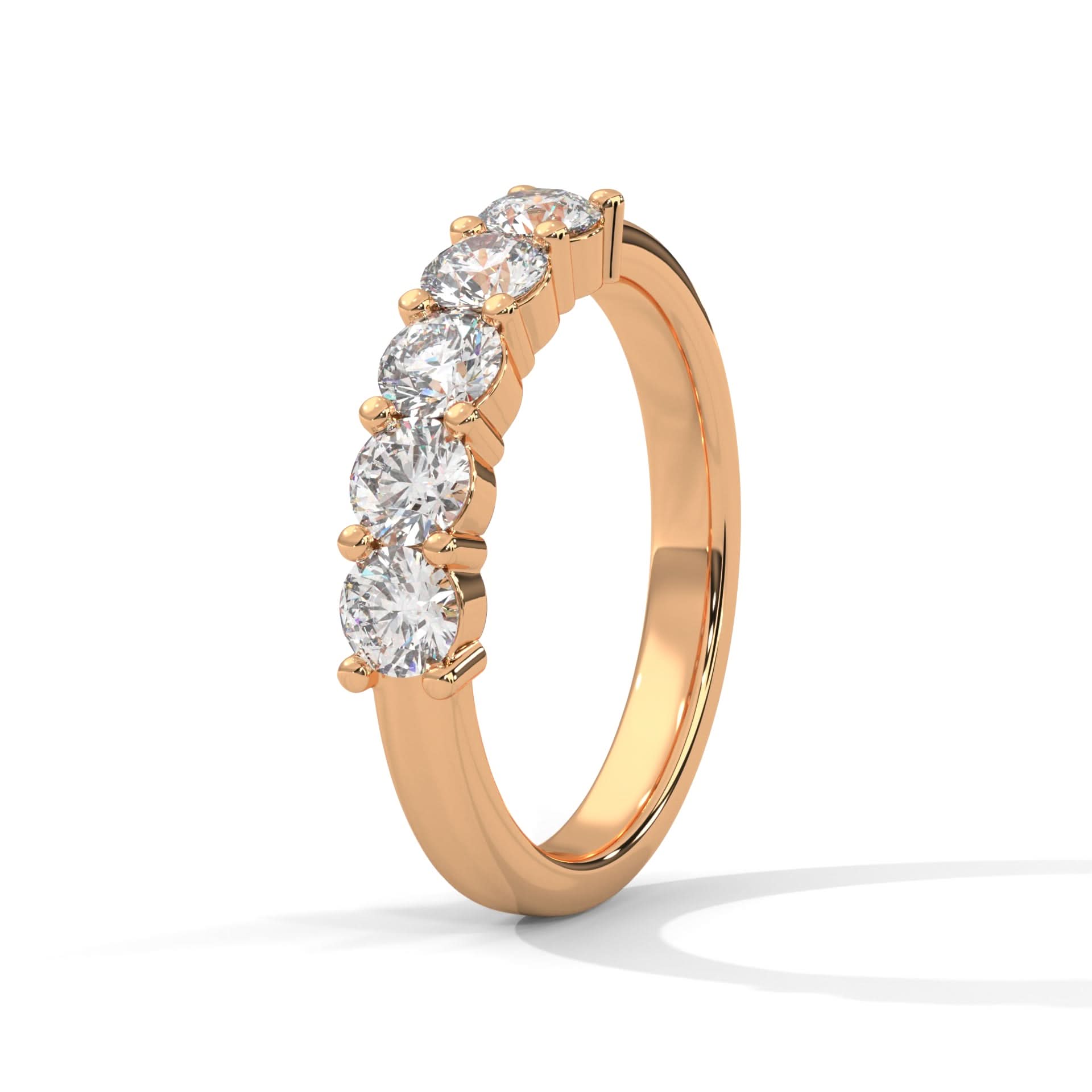 Rose gold ring with four diamonds on a white background