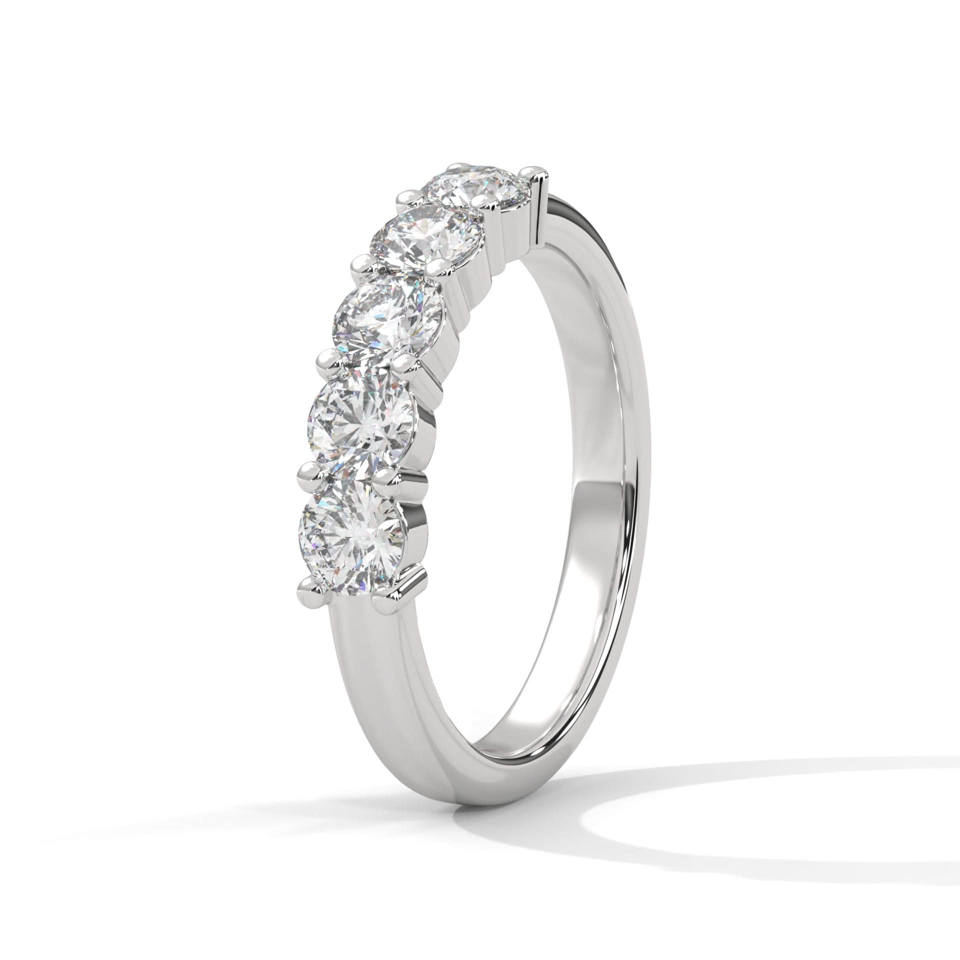 Diamond ring with five clear stones on a white background