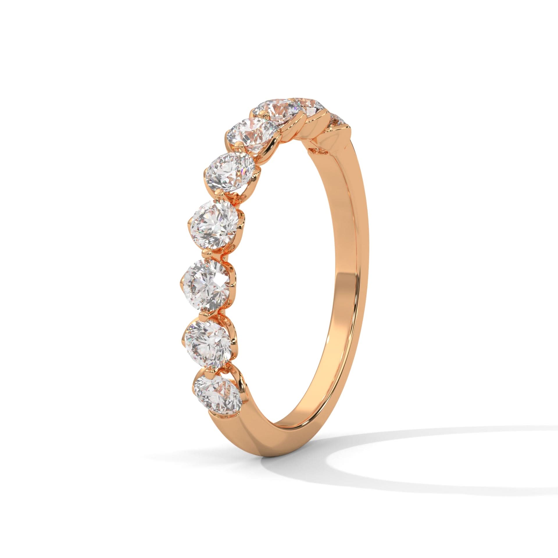 Rose gold ring with diamonds on a white background