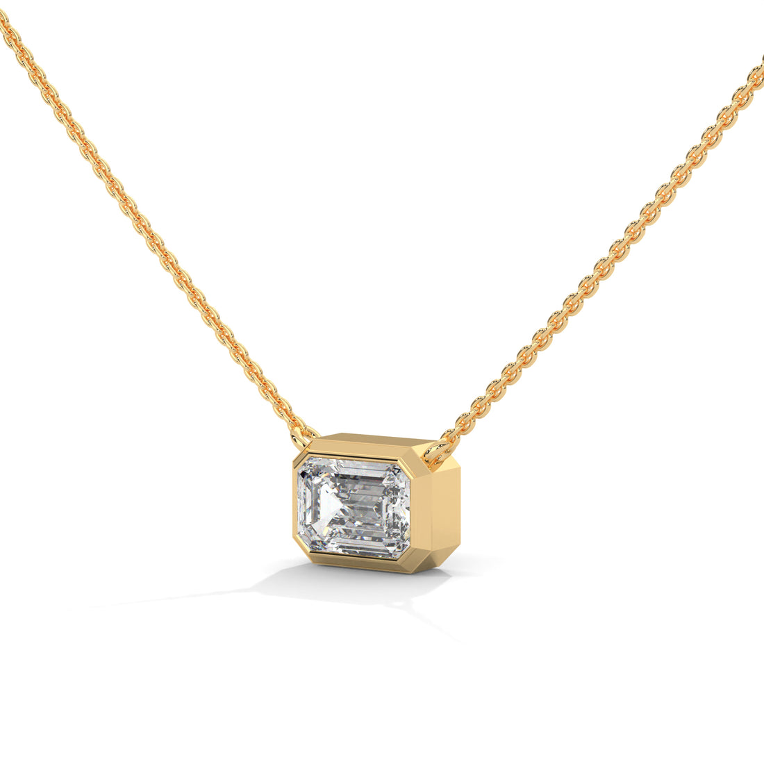 Gold necklace with a diamond pendant on a white background