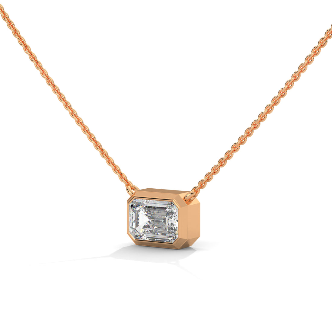 Rose gold necklace with a diamond pendant on a white background
