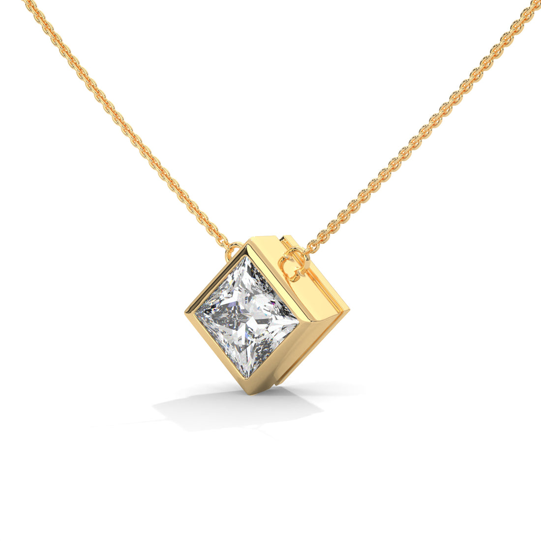 Gold necklace with a princess cut  pendant on a white background