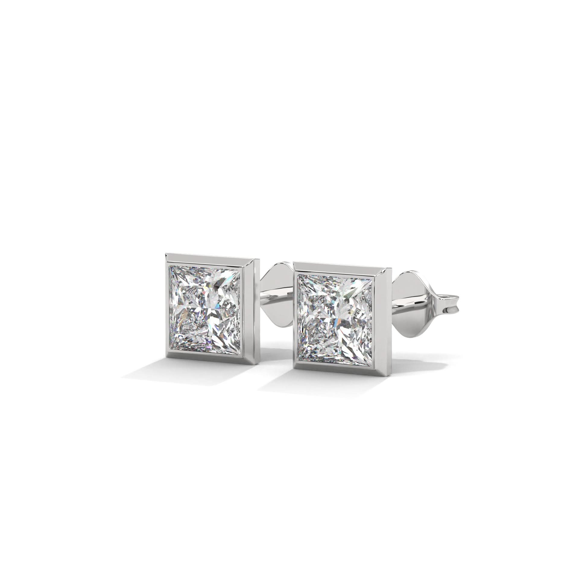 Pair of diamond stud earrings on a white background