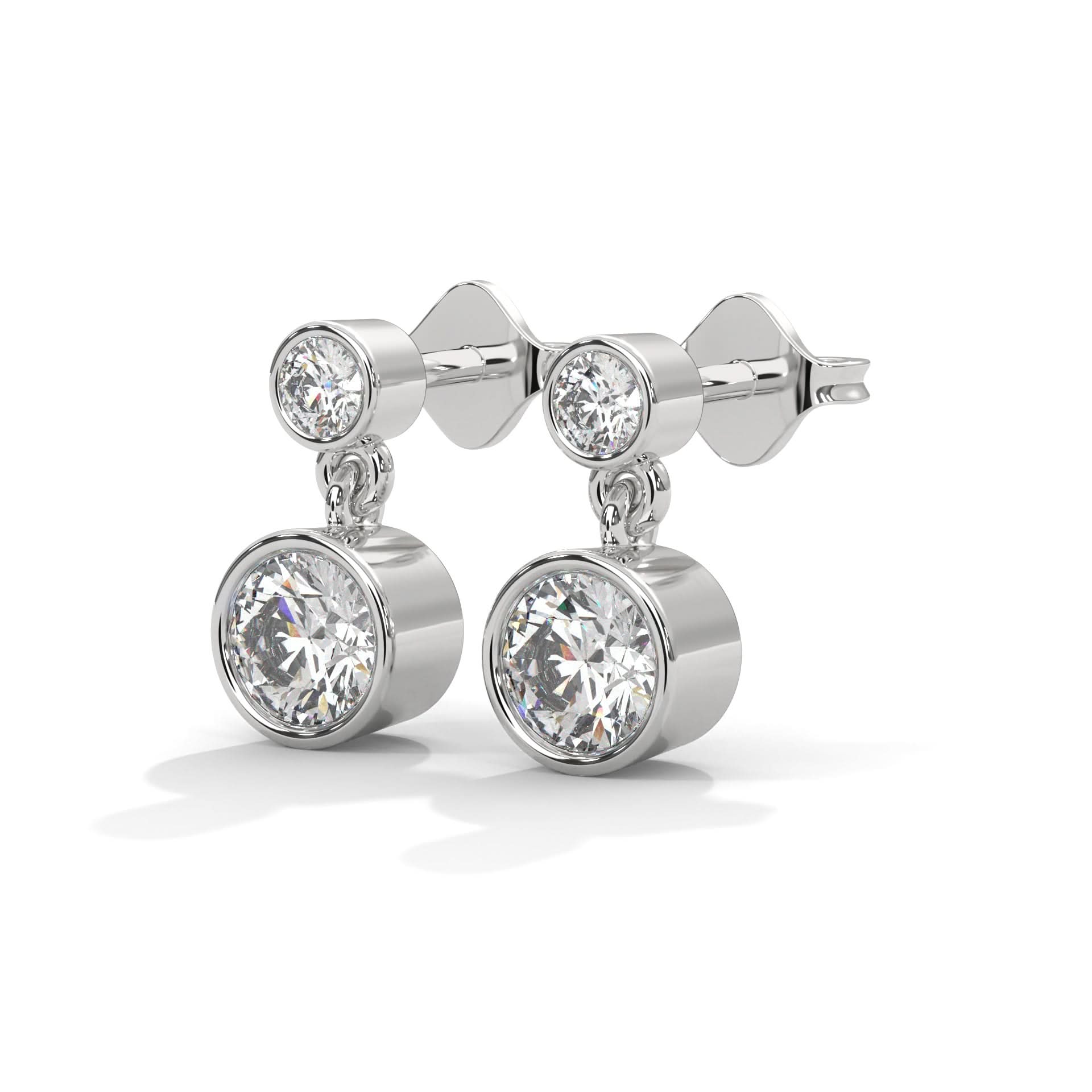 Pair of silver earrings with clear Diamond on a white background