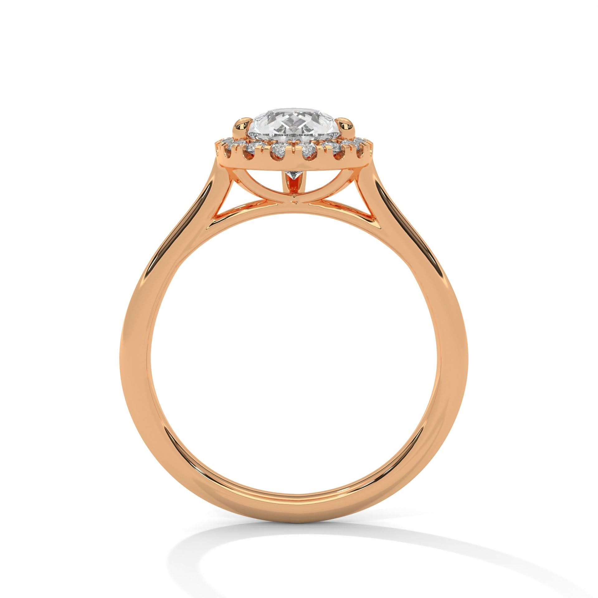Rose gold ring with a Pear diamond on a white background