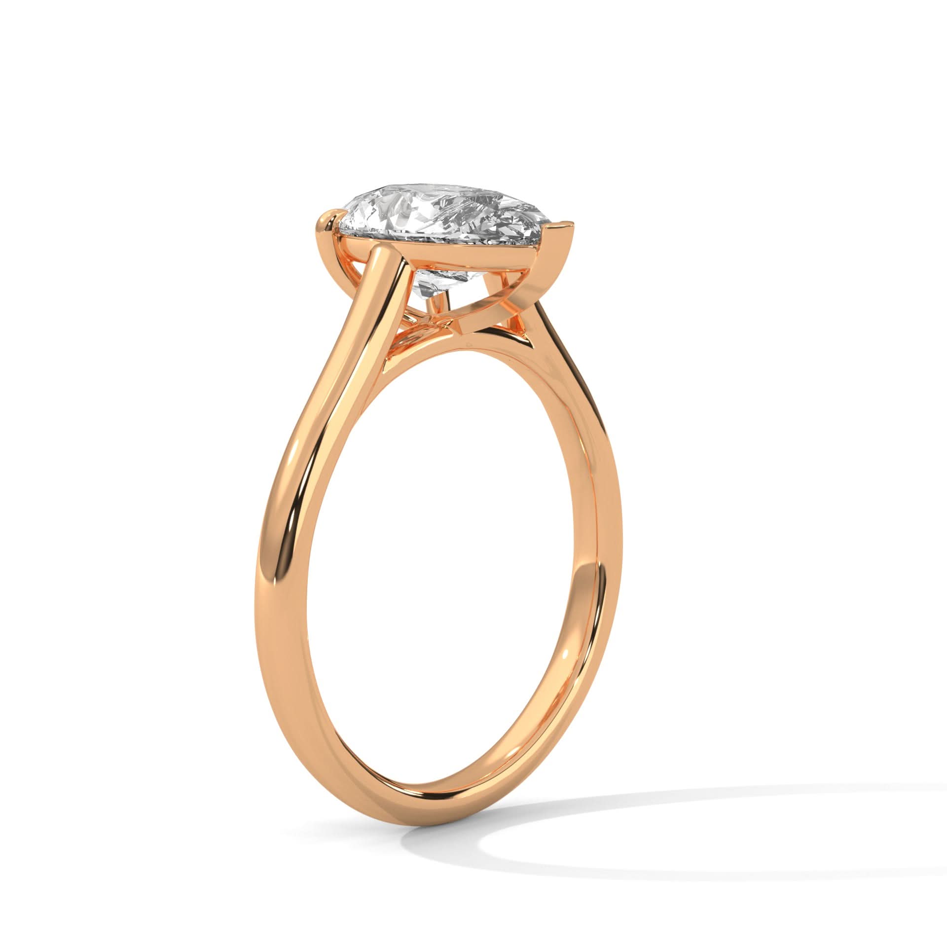 Rose gold ring with a diamond on a white background