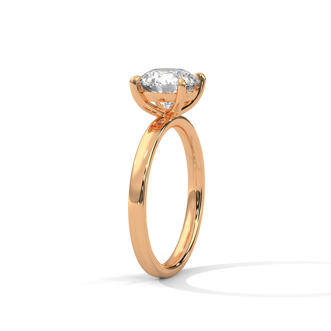Rose gold ring with a diamond on a white background