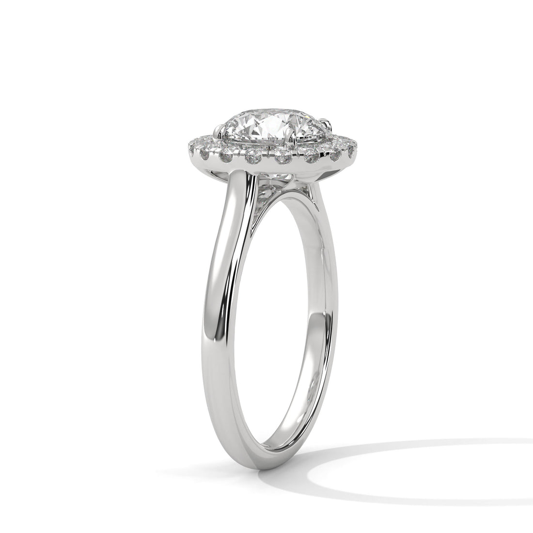 white gold ring with a diamond on a white background