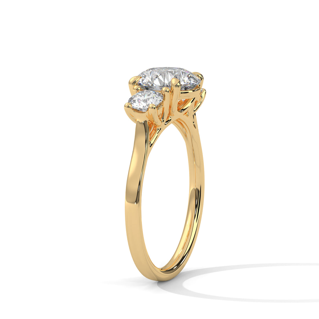 Gold ring with three diamonds on a white background