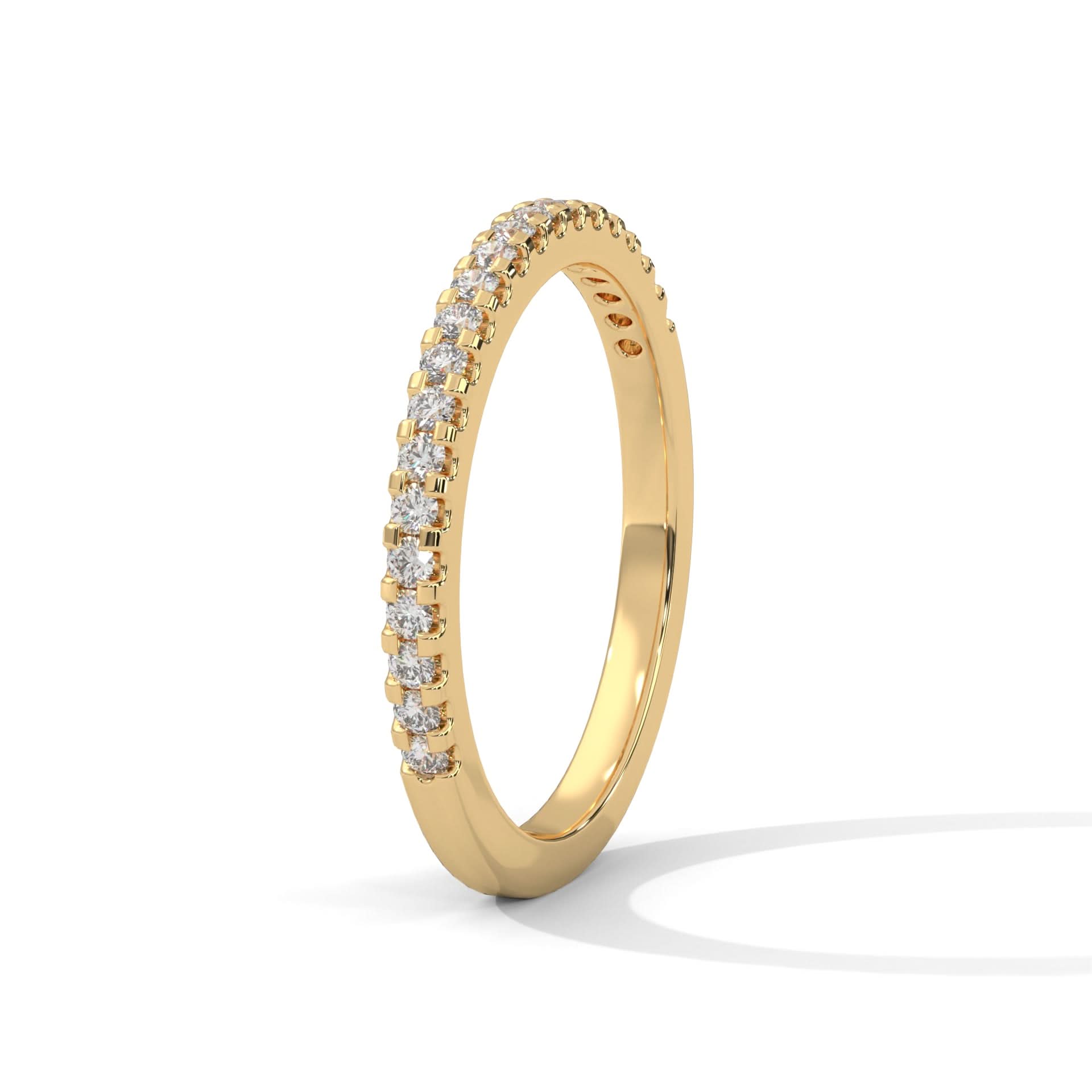 Gold ring with diamonds on a white background