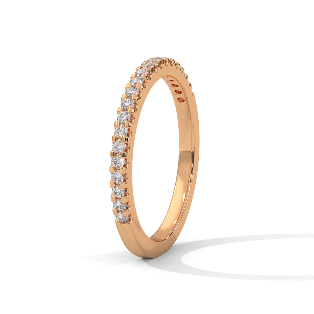 Rose gold ring with diamonds on a white background