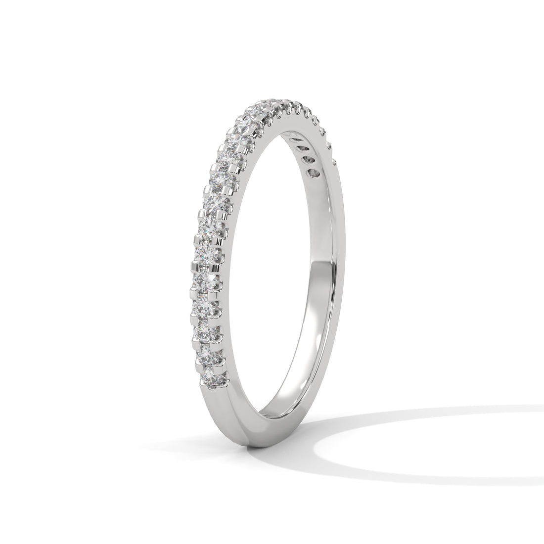 Silver ring with small diamonds on a white background
