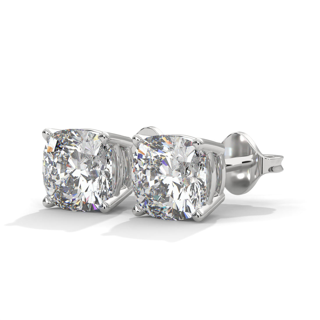 Pair of diamond stud earrings on a white background