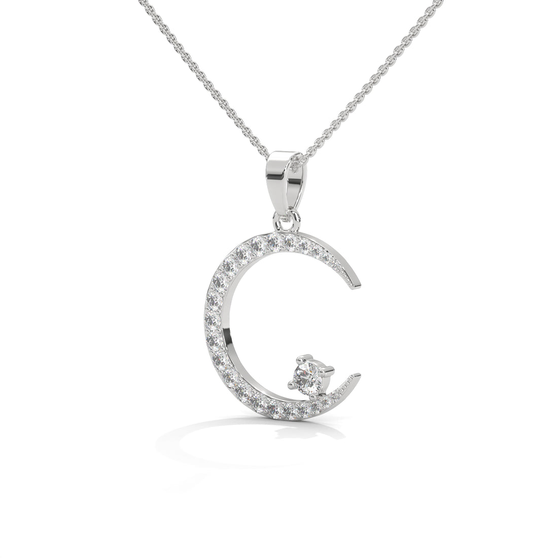 Silver moon-shaped pendant necklace on a white background
