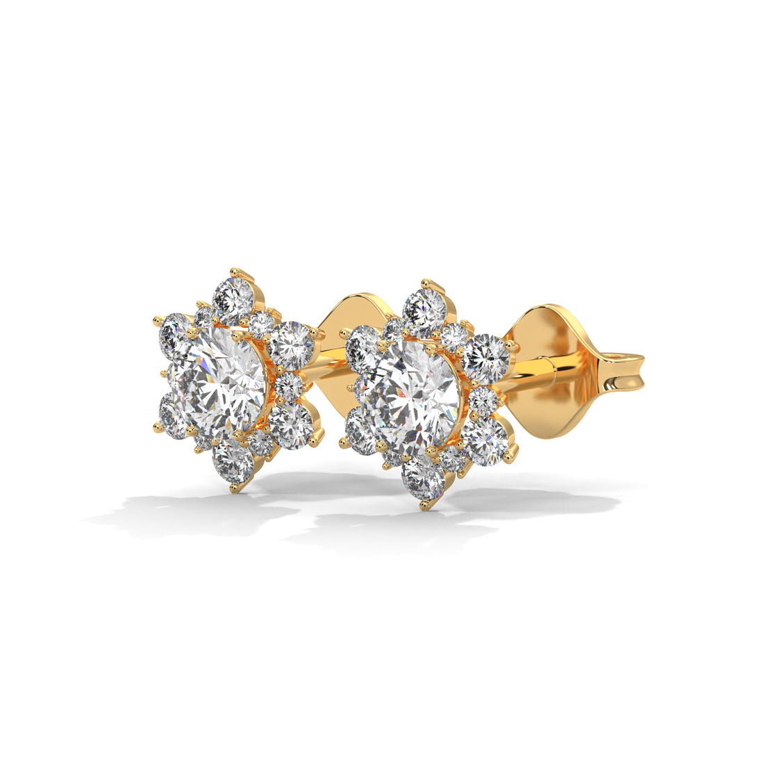 Gold earrings with clear gemstones on a white background