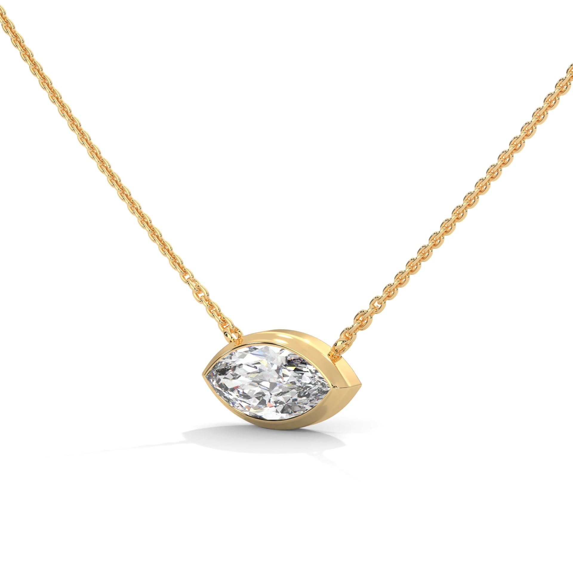 Gold necklace with a diamond pendant on a white background
