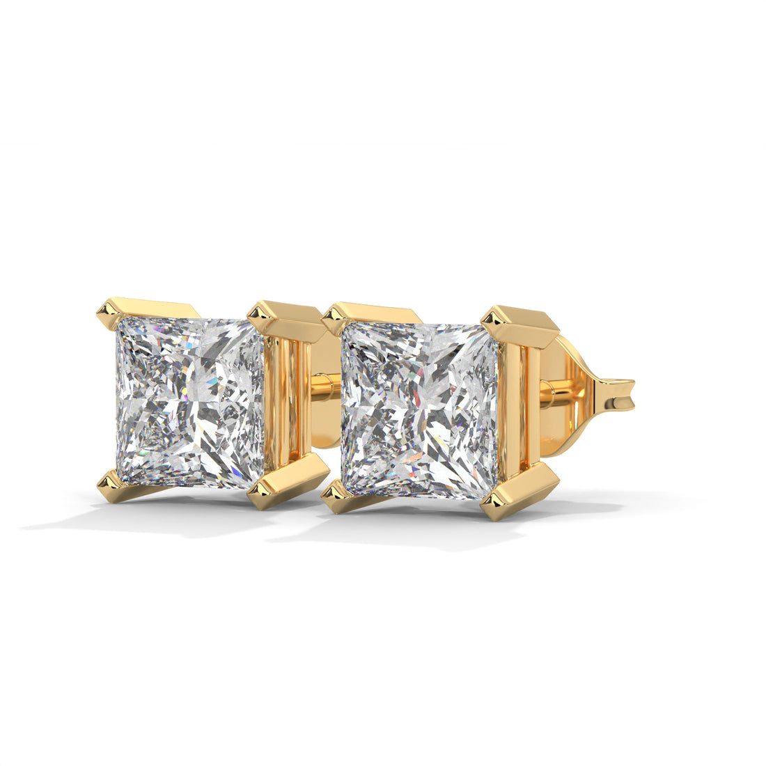 Gold earrings with clear gemstones on a white background