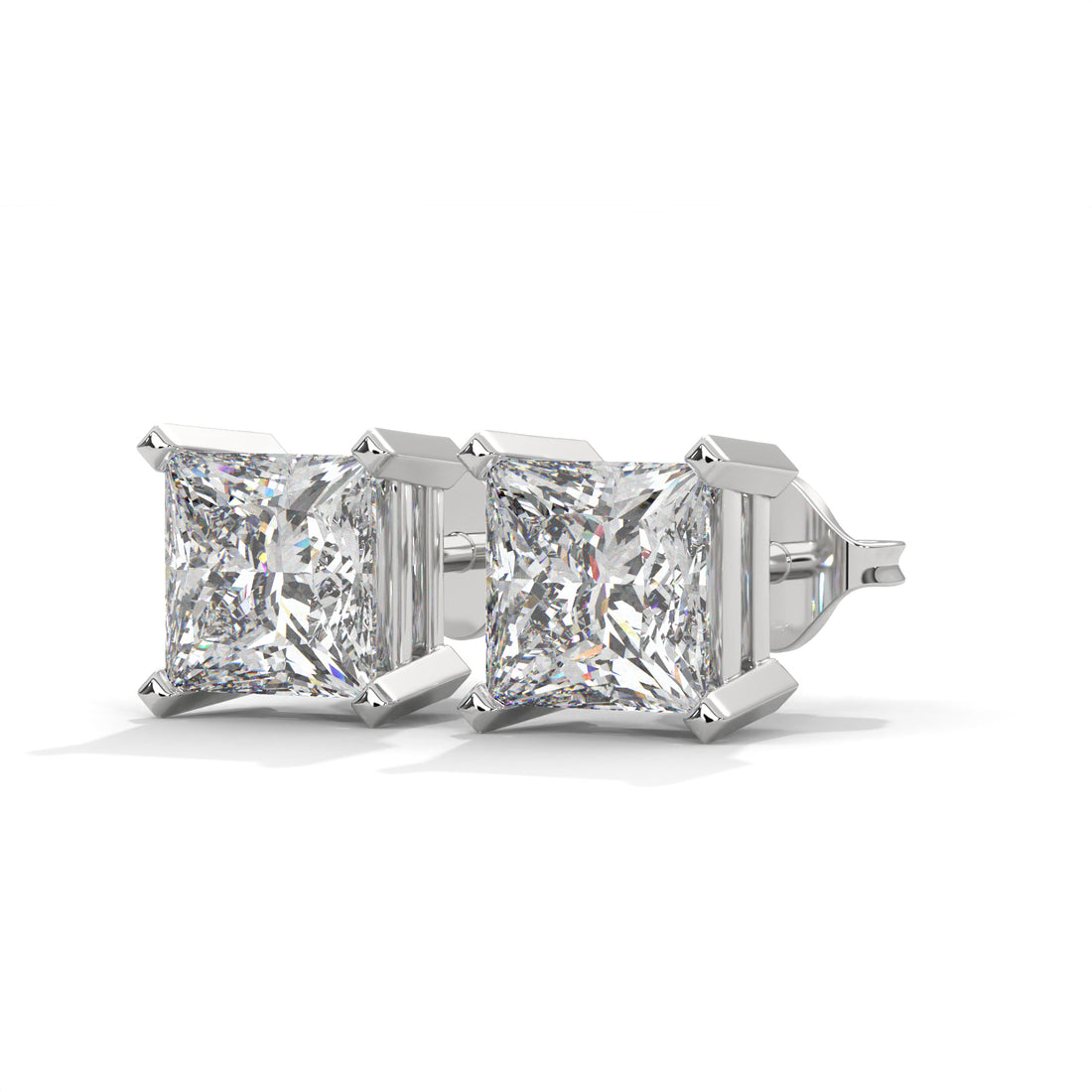 Pair of diamond stud earrings on a white background
