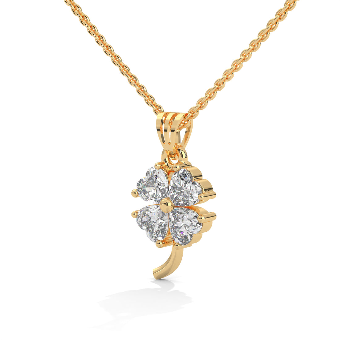 Gold four-leaf clover pendant necklace on a white background