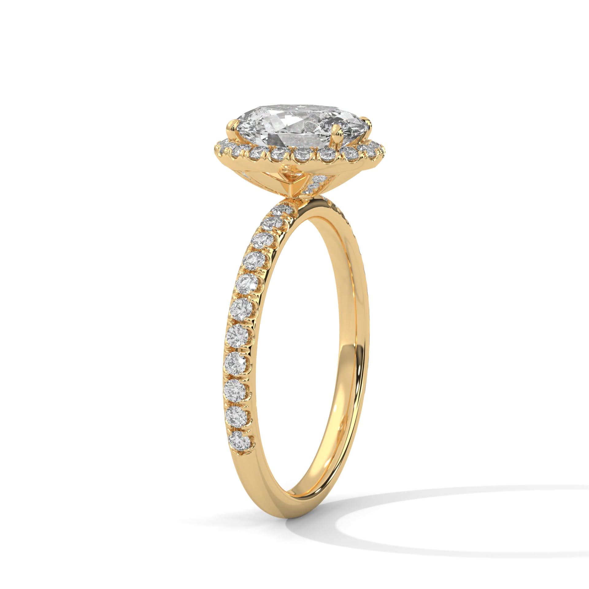Gold ring with a large diamond and smaller diamonds on the band against a white background