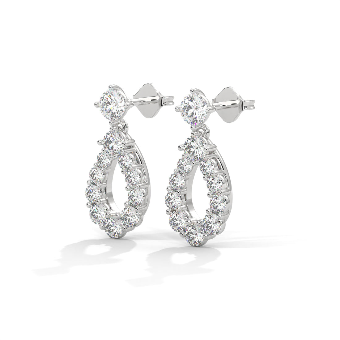 Pair of silver hoop earrings on a white background