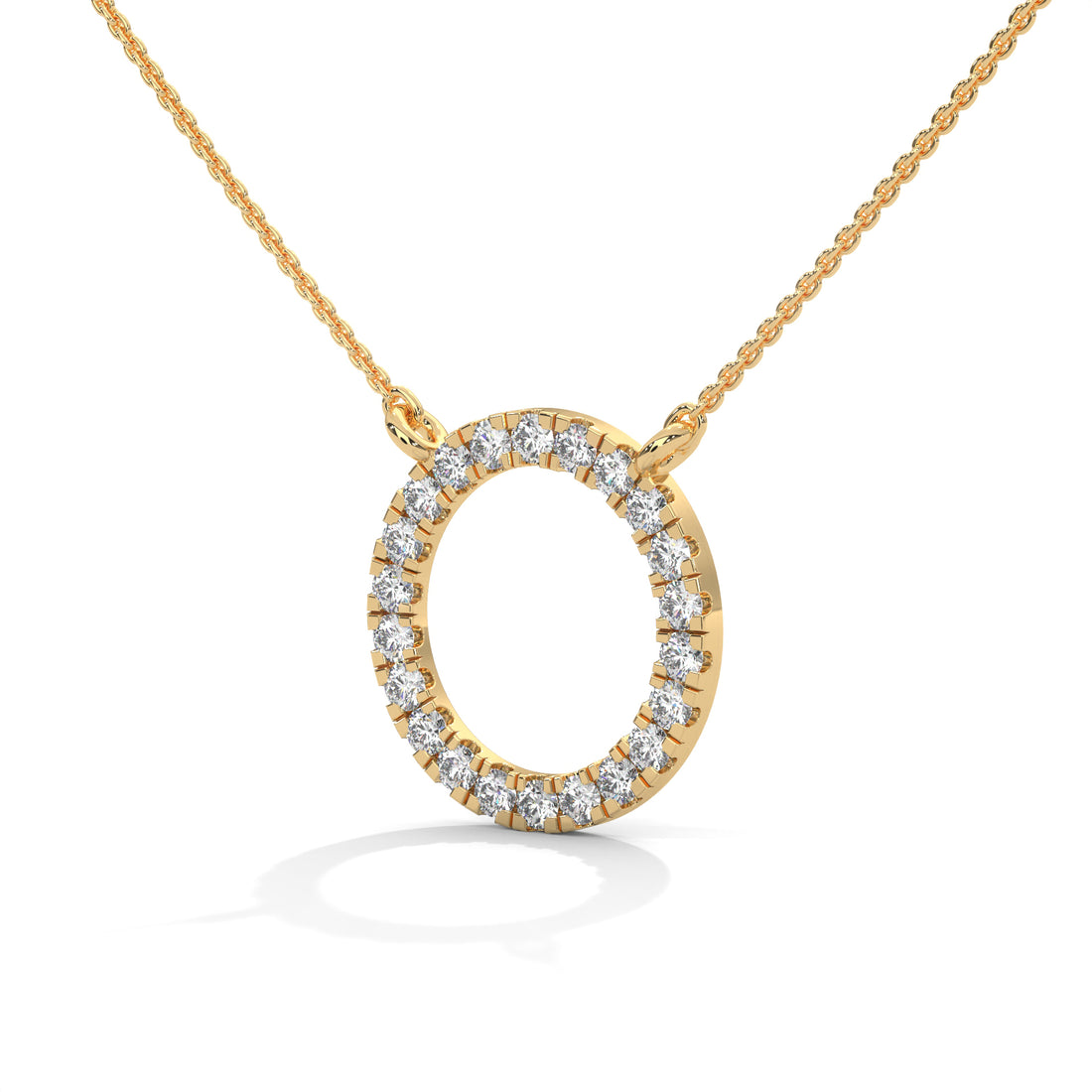 Gold necklace with a round diamond pendant on a white background