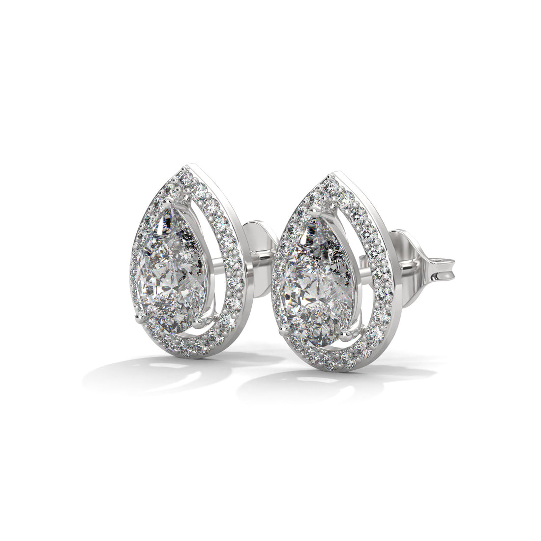 Pair of silver teardrop earrings with clear gemstones on a white background