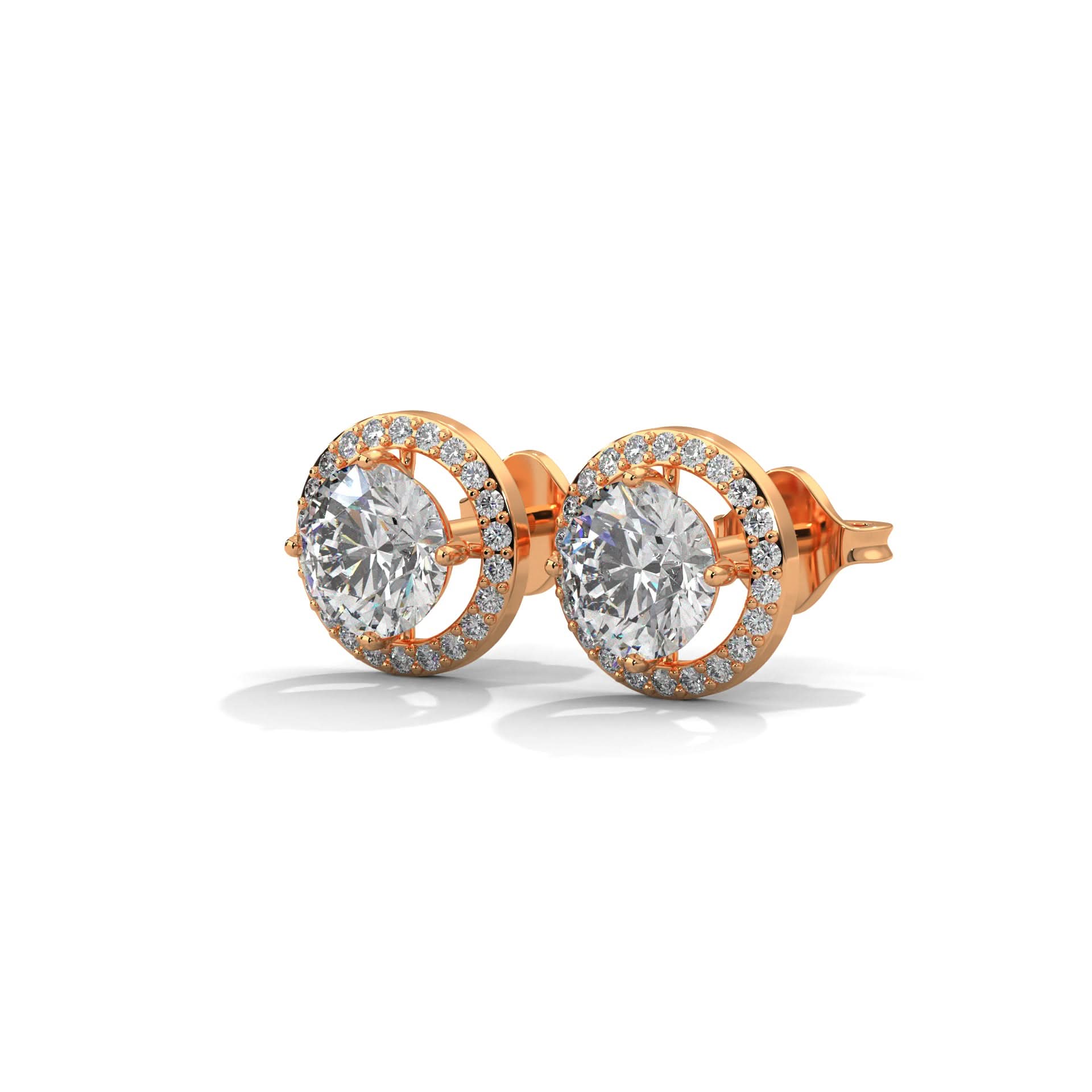 Rose gold earrings with large gemstones on a white background