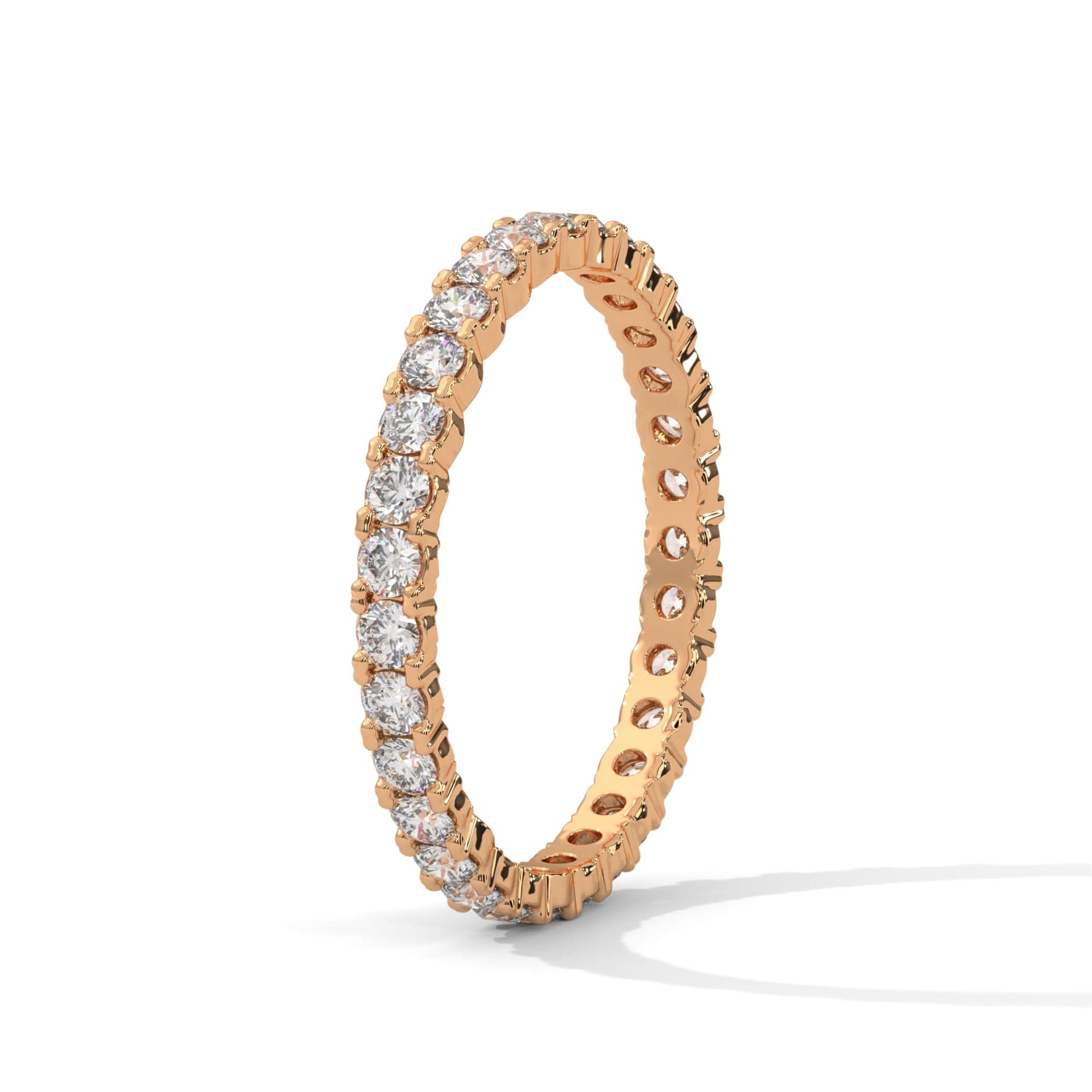 Rose gold ring with diamonds on a white background