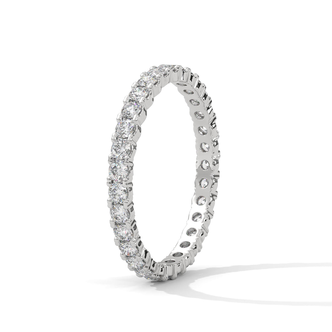 Silver ring with diamond accents on a white background